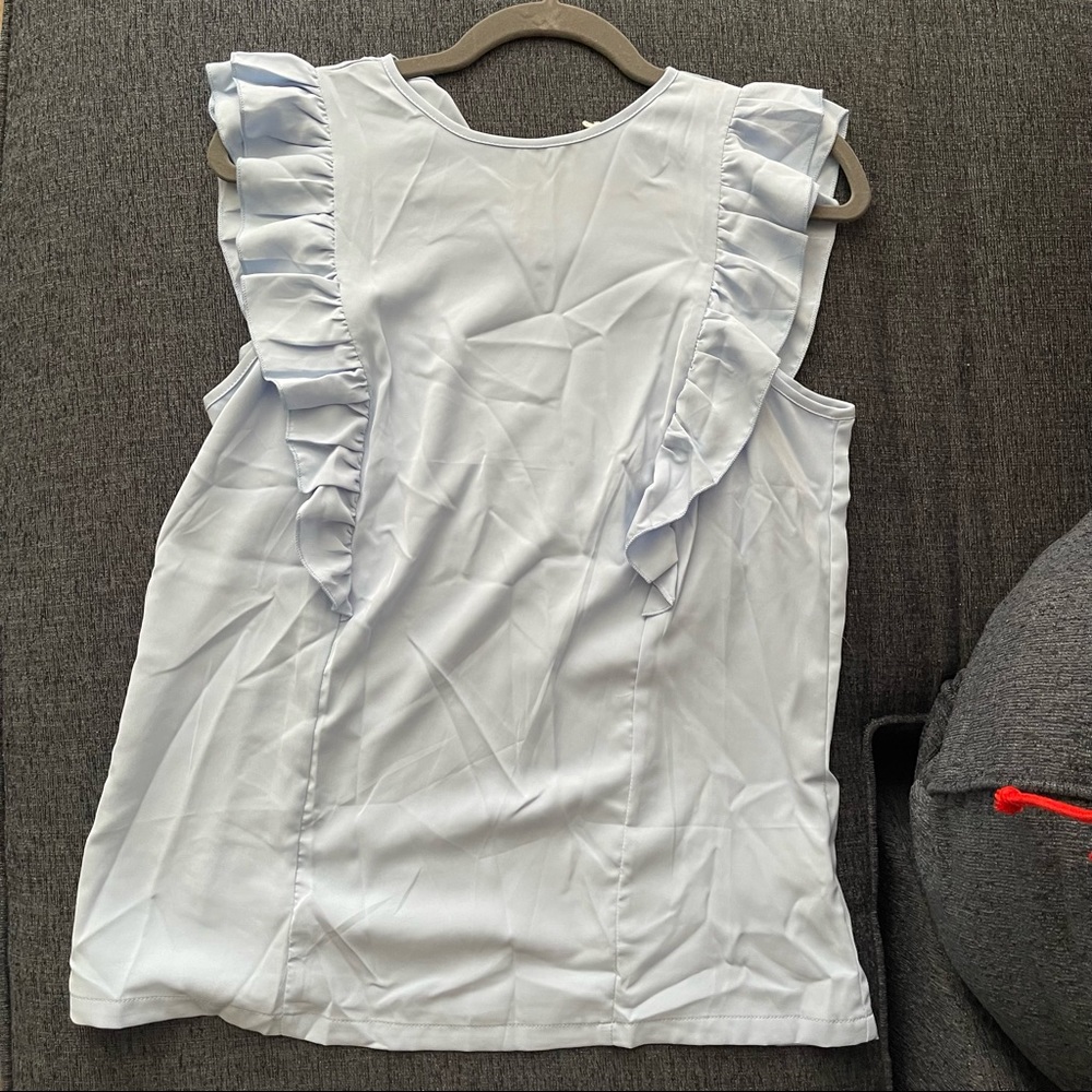 Blue ruffled blouse